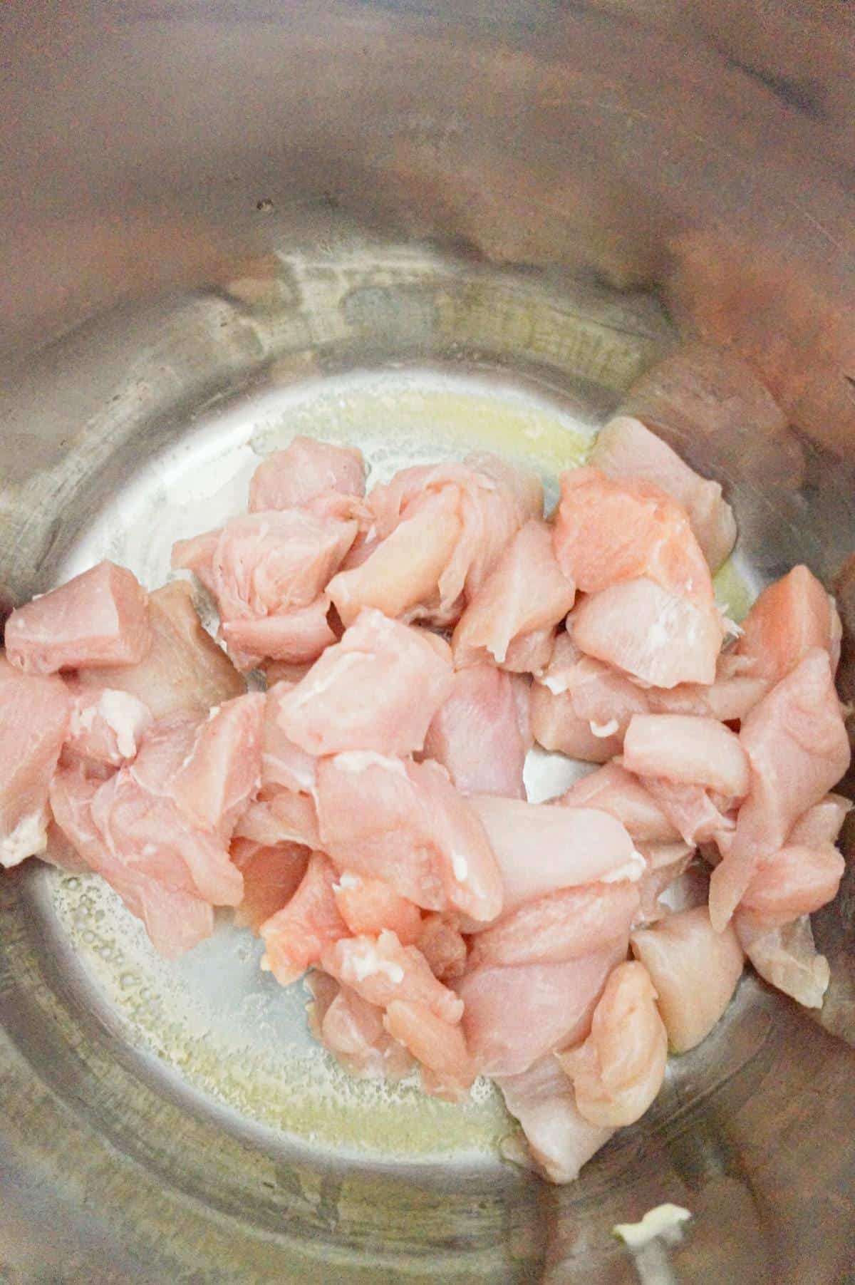 raw chicken breast chunks in an Instant Pot