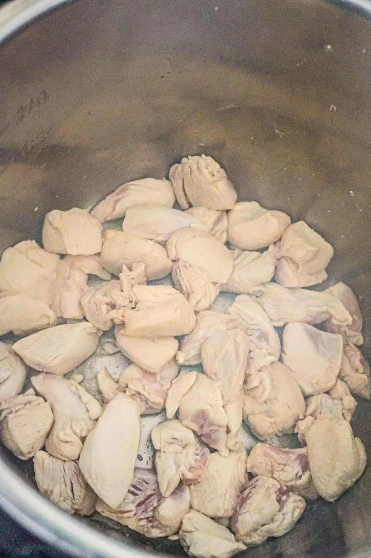 chicken breast chunks cooking in an Instant Pot