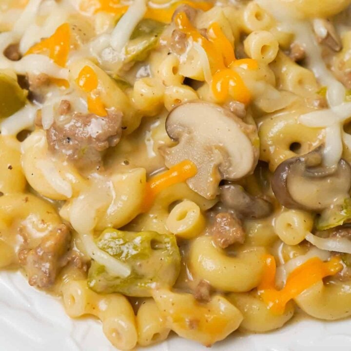 Instant Pot Philly Cheese Steak Pasta is a hearty pressure cooker macaroni recipe loaded with ground beef, green peppers, onions, mushrooms and cheese.