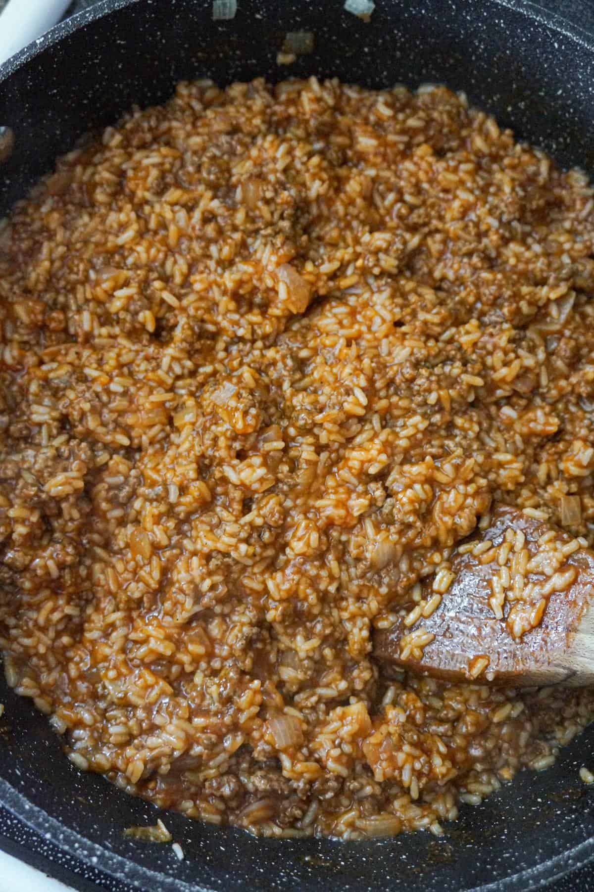 sloppy joe ground beef and rice mixture in a saute pan