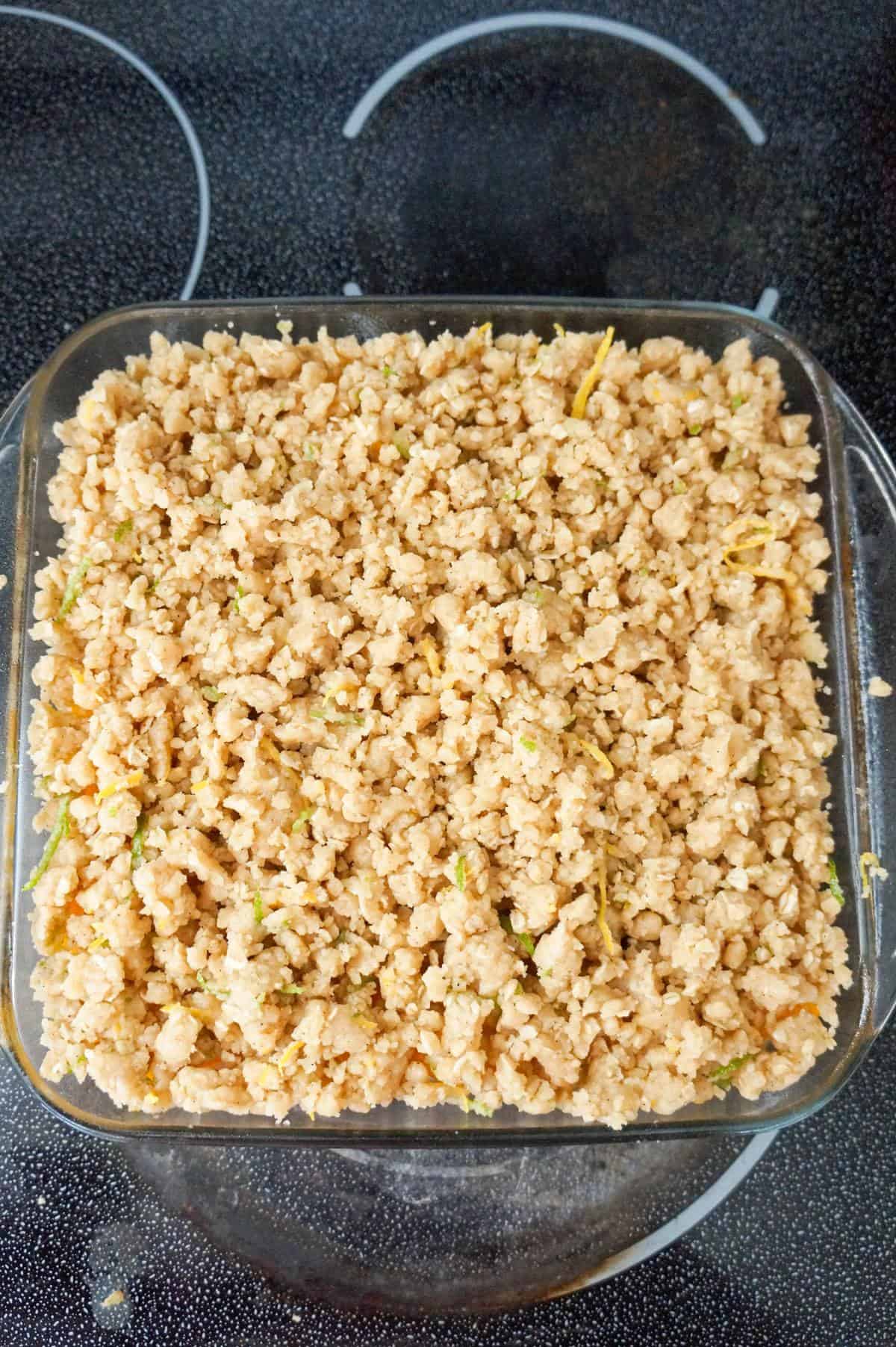 peach crumble in a dish before baking