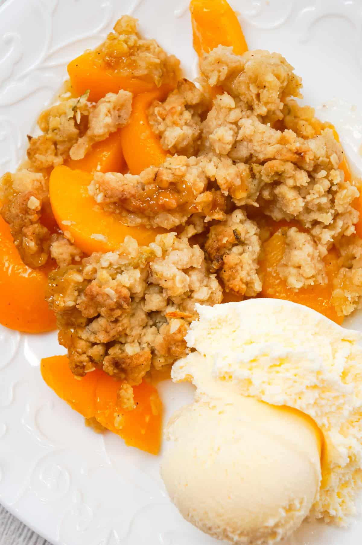 Peach Crumble is a delicious dessert recipe made with canned peaches and topped with a crunchy crumble topping with hints of cinnamon and citrus.