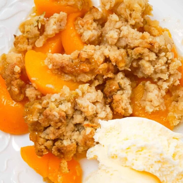 Peach Crumble is a delicious dessert recipe made with canned peaches and topped with a crunchy crumble topping with hints of cinnamon and citrus.