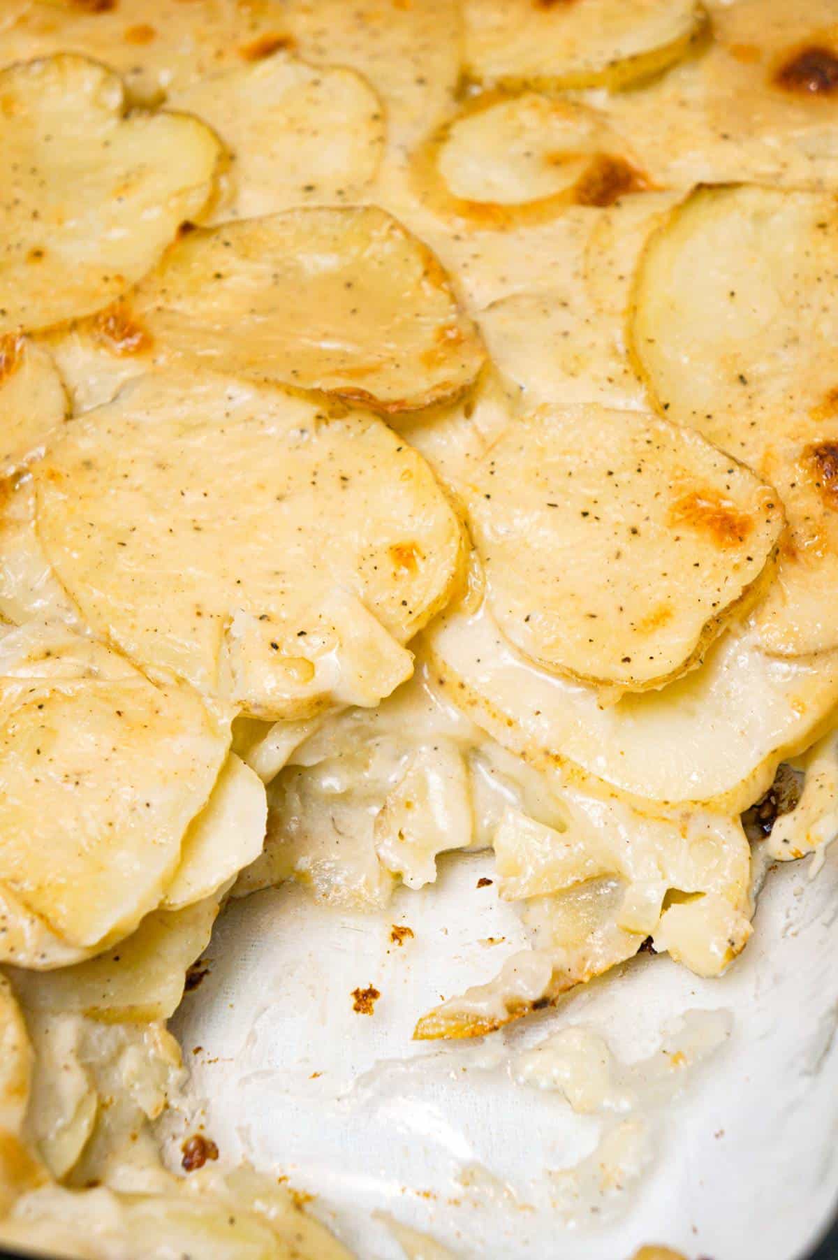 Scalloped Potatoes are a delicious side dish recipe made with thinly sliced potatoes layered with a creamy onion sauce and baked in the oven.