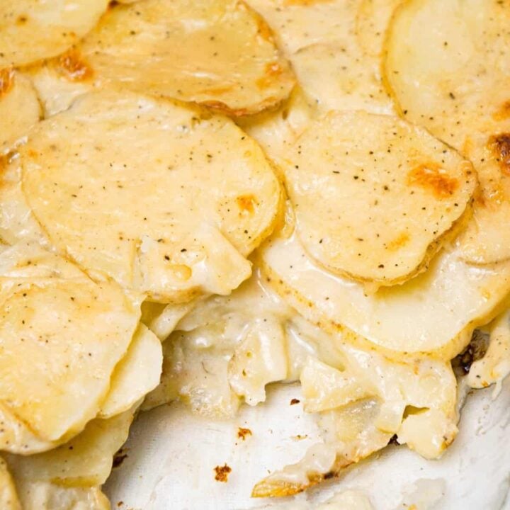 Scalloped Potatoes are a delicious side dish recipe made with thinly sliced potatoes layered with a creamy onion sauce and baked in the oven.