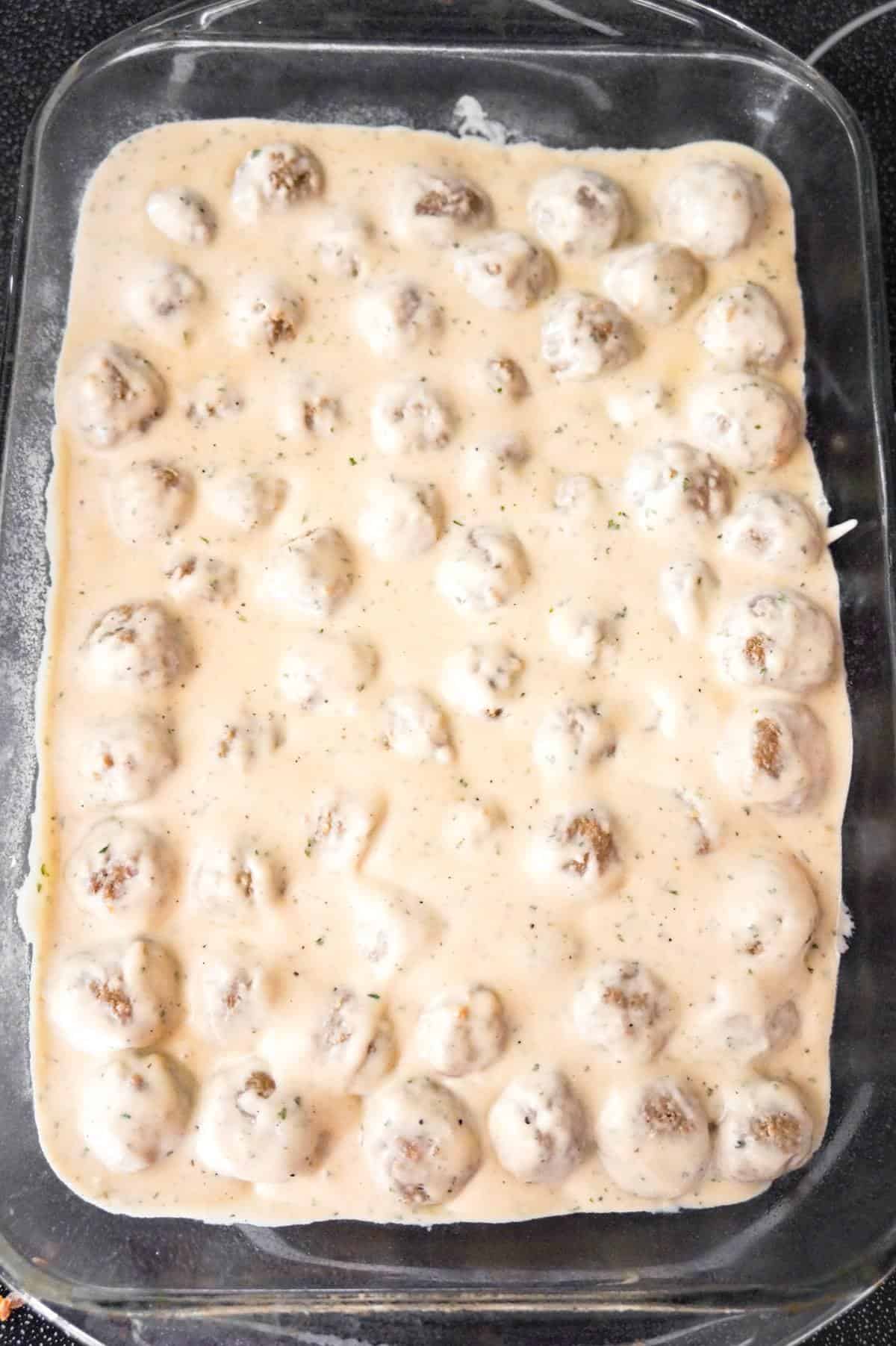 swedish meatballs with cream sauce in a baking dish