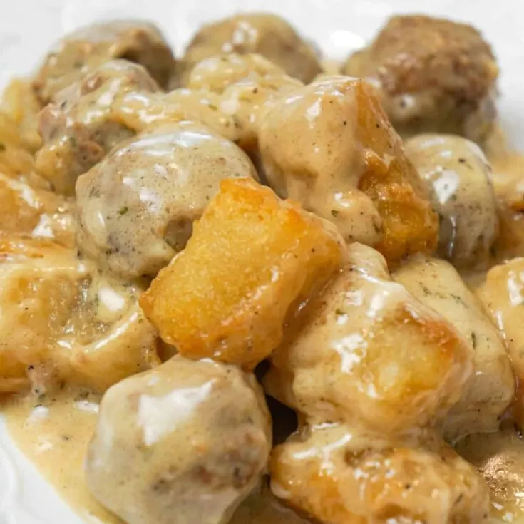 Swedish Meatball Tater Tot Casserole is an easy casserole recipe made with frozen Swedish meatballs smothered in a creamy gravy and topped with mozzarella cheese and tater tots.