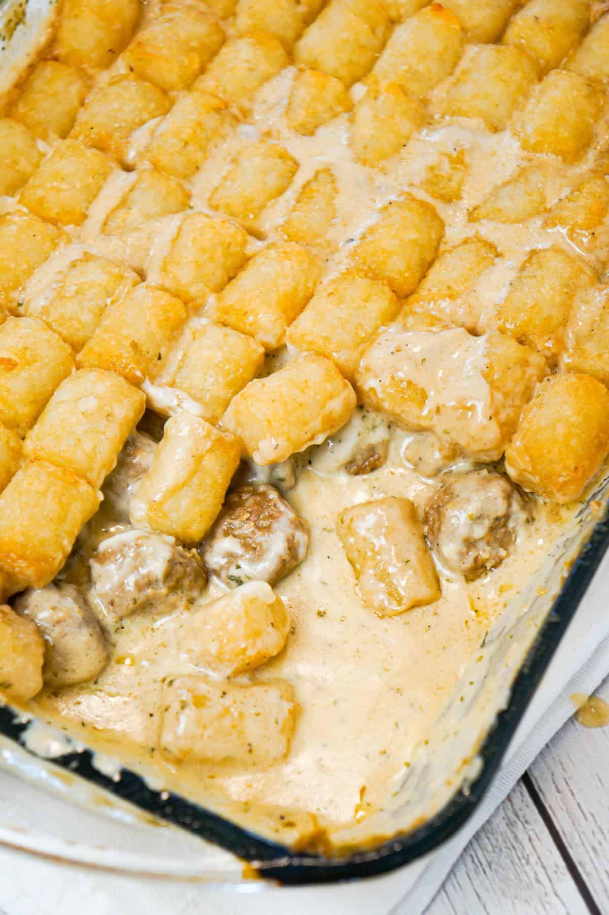 Swedish Meatball Tater Tot Casserole is an easy casserole recipe made with frozen Swedish meatballs smothered in a creamy gravy and topped with mozzarella cheese and tater tots.