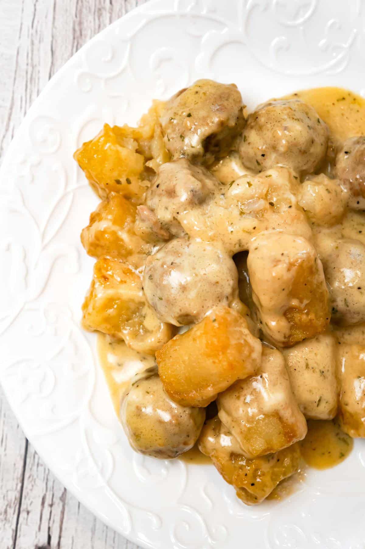 Swedish Meatball Tater Tot Casserole is an easy casserole recipe made with frozen Swedish meatballs smothered in a creamy gravy and topped with mozzarella cheese and tater tots.