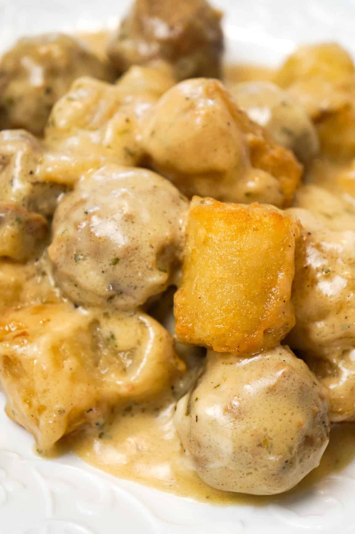 Swedish Meatball Tater Tot Casserole is an easy casserole recipe made with frozen Swedish meatballs smothered in a creamy gravy and topped with mozzarella cheese and tater tots.