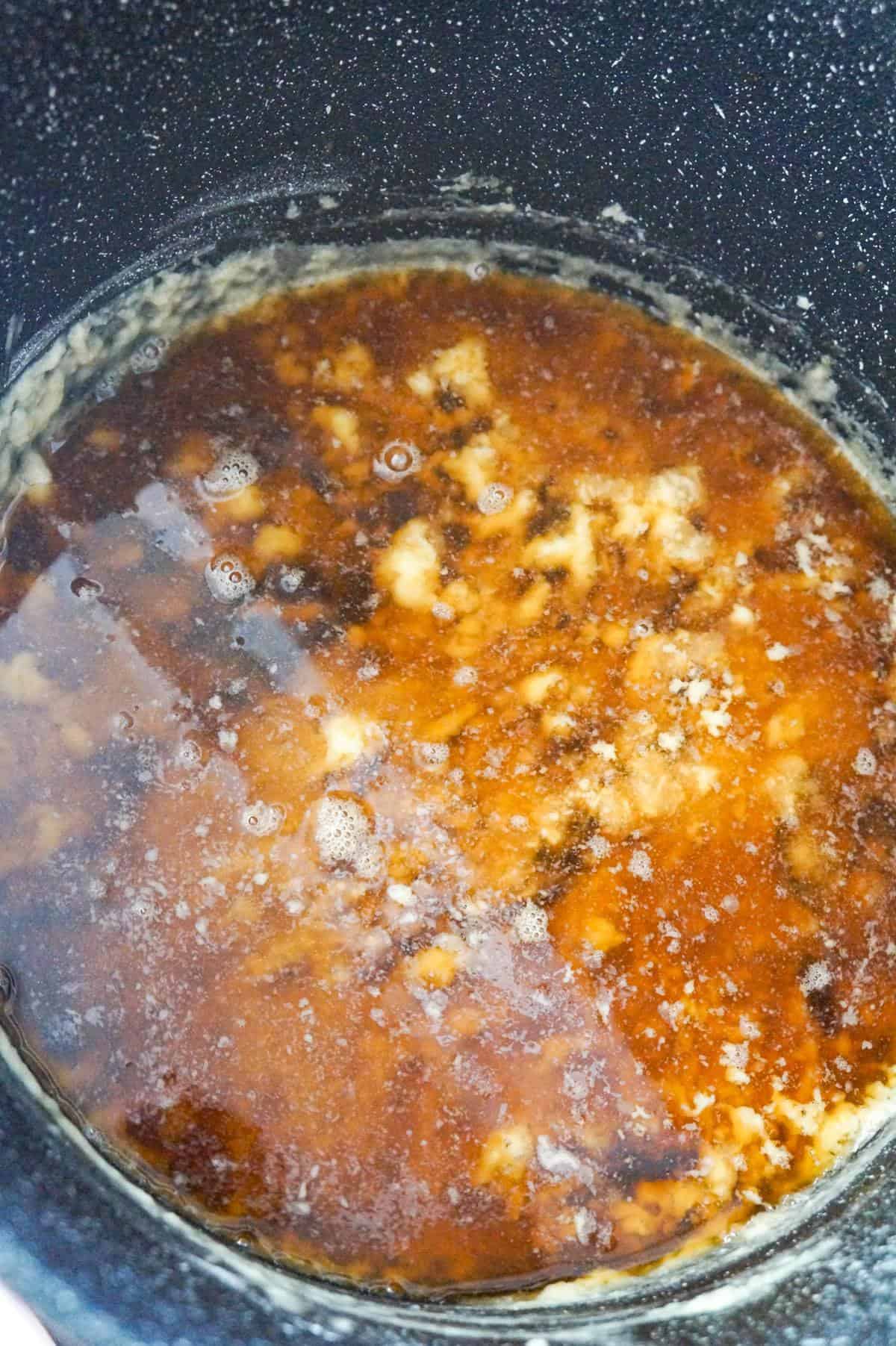 beef broth in a large pot with flour and butter mixture