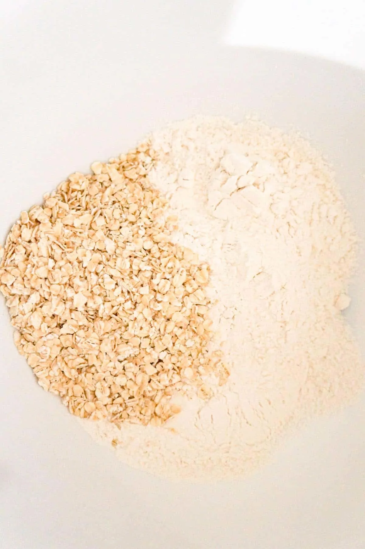 flour and quick oats in a mixing bowl