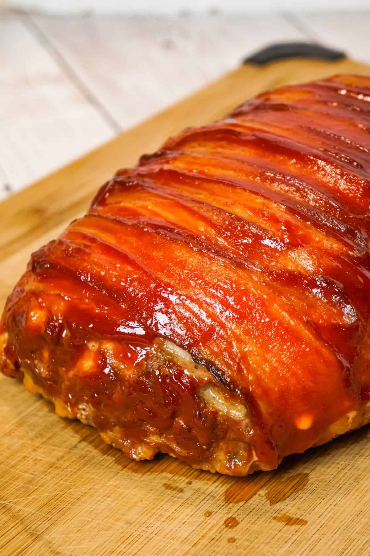 Bacon Wrapped Meatloaf is a delicious ground beef meatloaf with a ketchup glaze wrapped in strips of bacon.