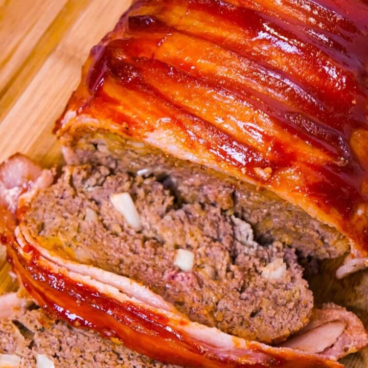 Bacon Wrapped Meatloaf is a delicious ground beef meatloaf with a ketchup glaze wrapped in strips of bacon.