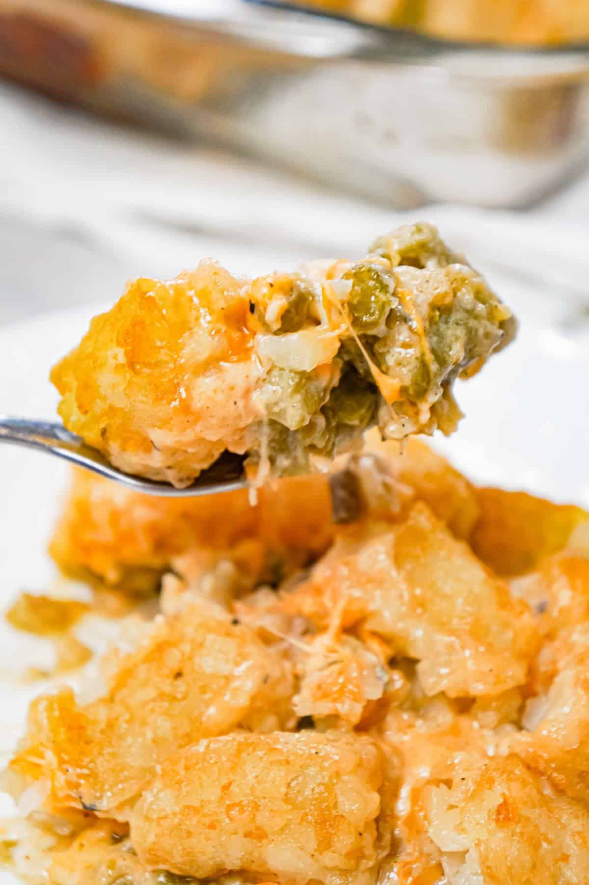 Green Bean Casserole with Tater Tots is an easy side dish recipe made with canned green beans and loaded with cream of mushroom soup, French's fried onions, shredded cheese and tater tots.