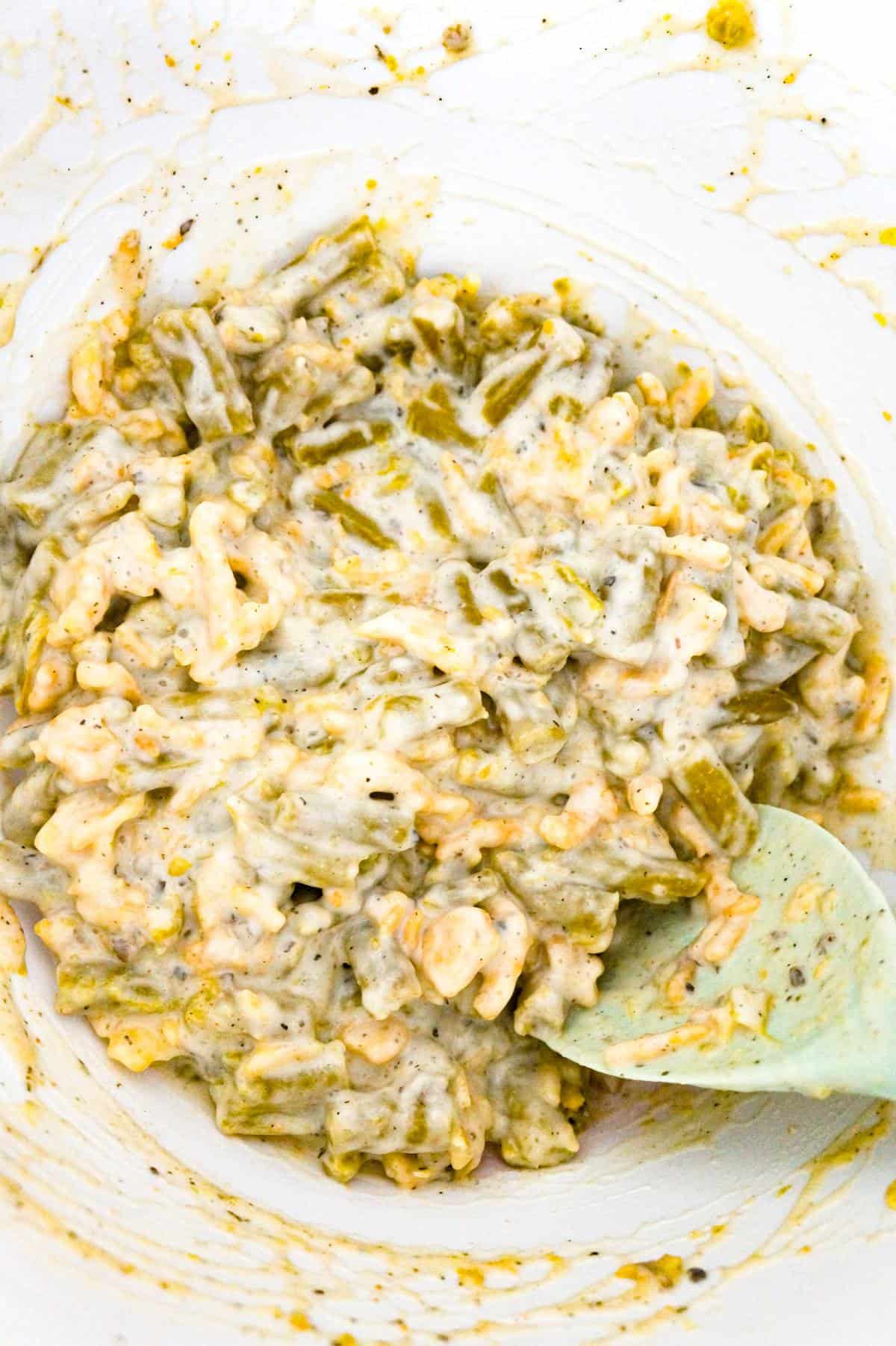 green bean and cream of mushroom soup in a mixing bowl