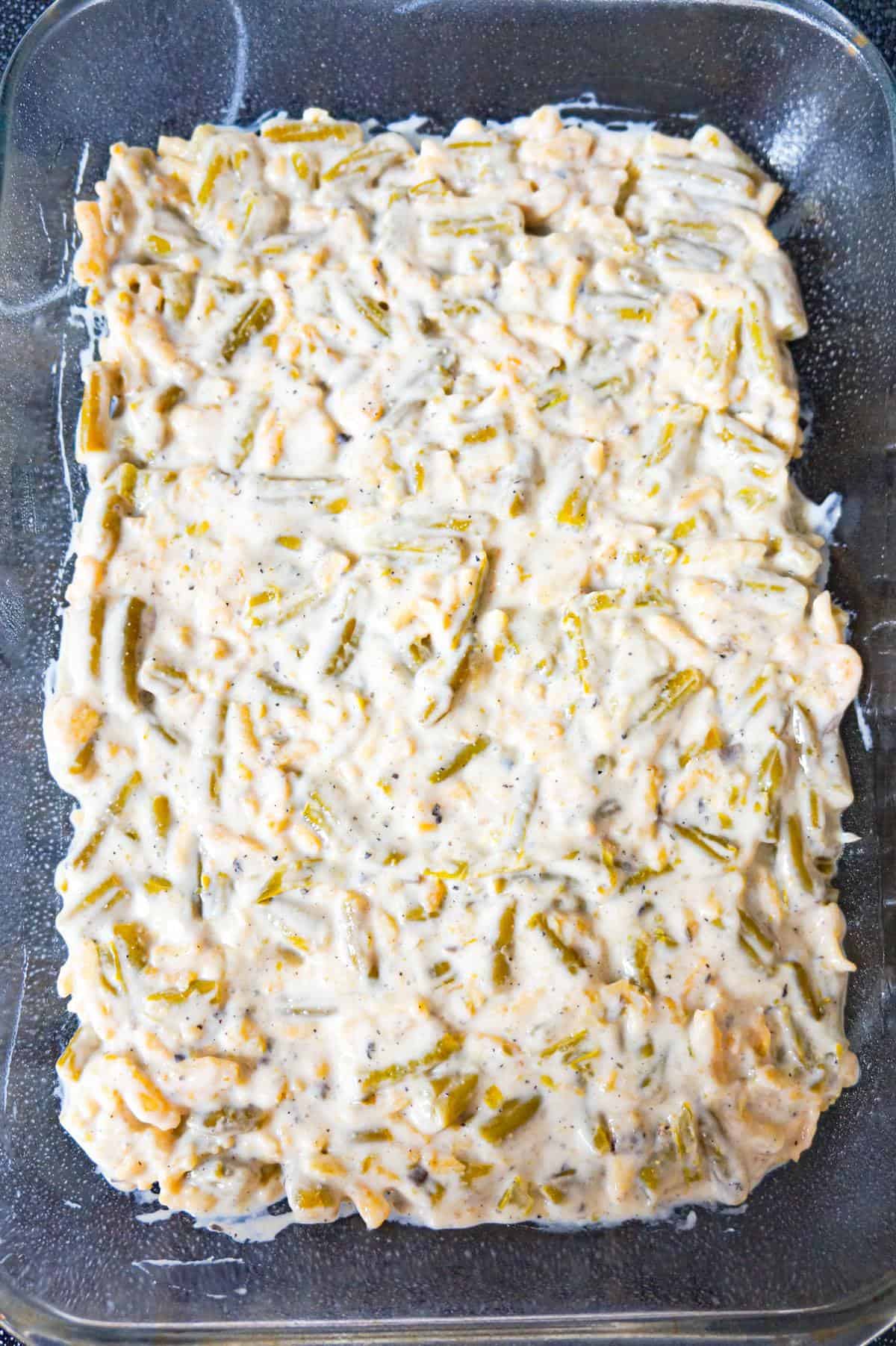 green bean and cream of mushroom soup mixture in a baking dish