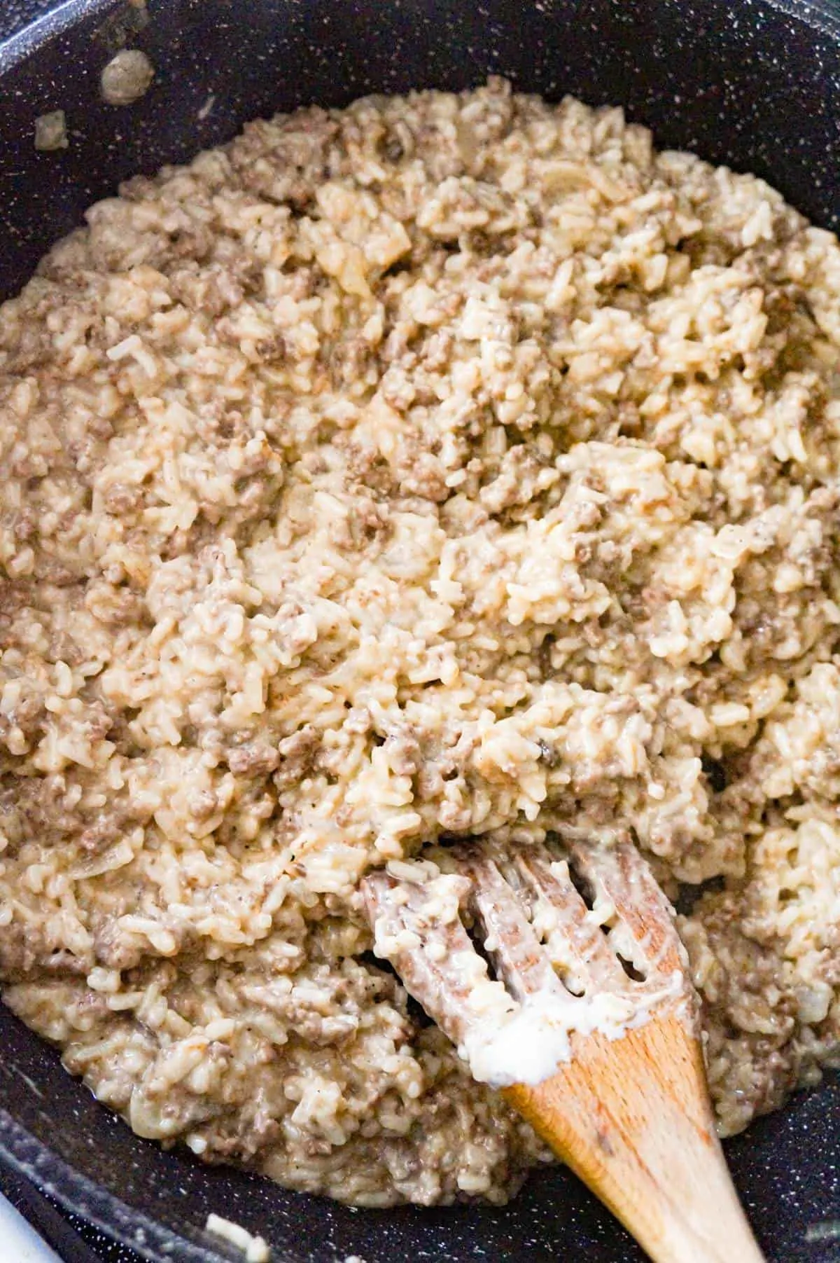creamy ground beef and rice mixture in a pan