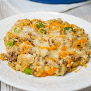 One Pot Philly Cheese Steak Ground Beef and Rice is an easy stove top dinner recipe loaded with hamburger meat, green peppers, sliced mushrooms, instant rice, cream of mushroom soup and shredded cheese.