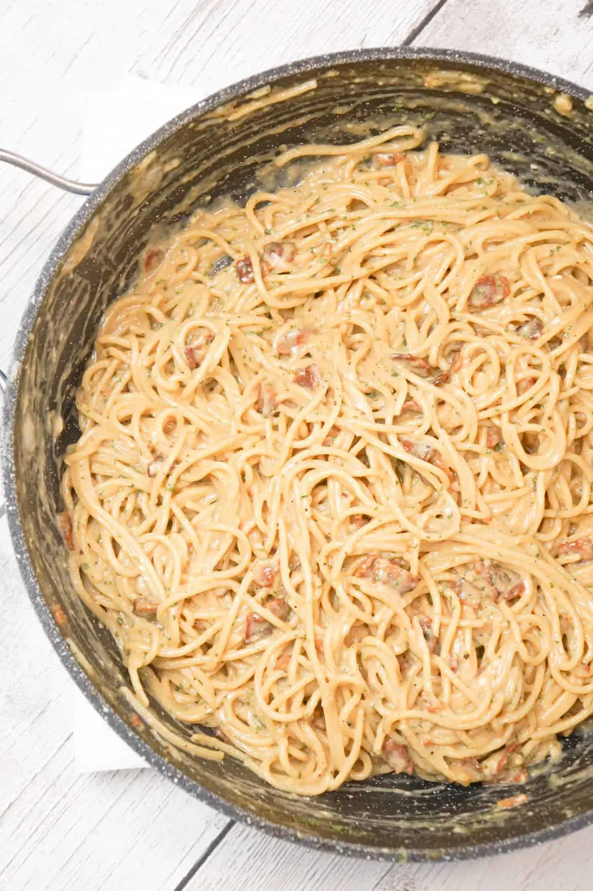 Spaghetti Carbonara is an easy pasta dish loaded with crispy bacon and tossed in an egg and Parmesan sauce.