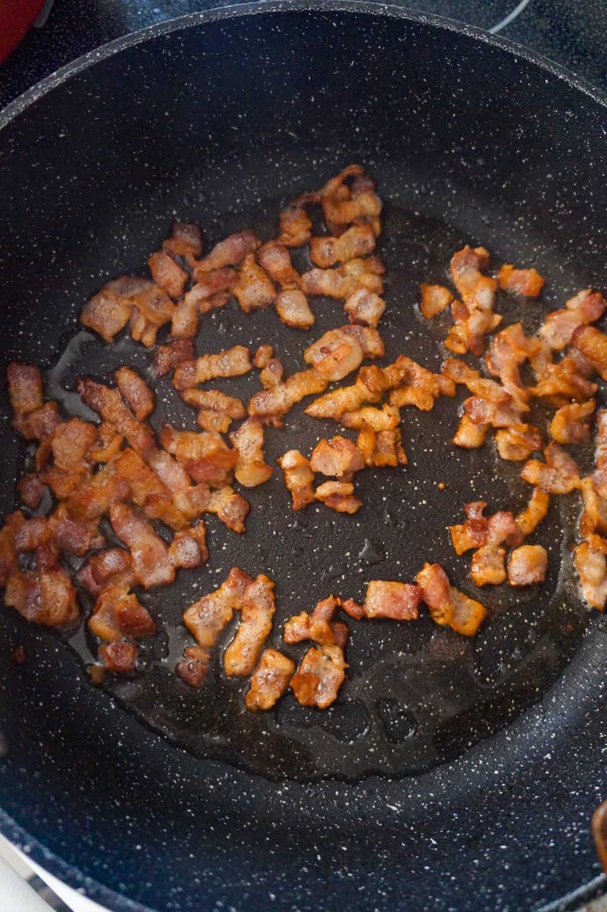 cooked diced bacon in a saute pan