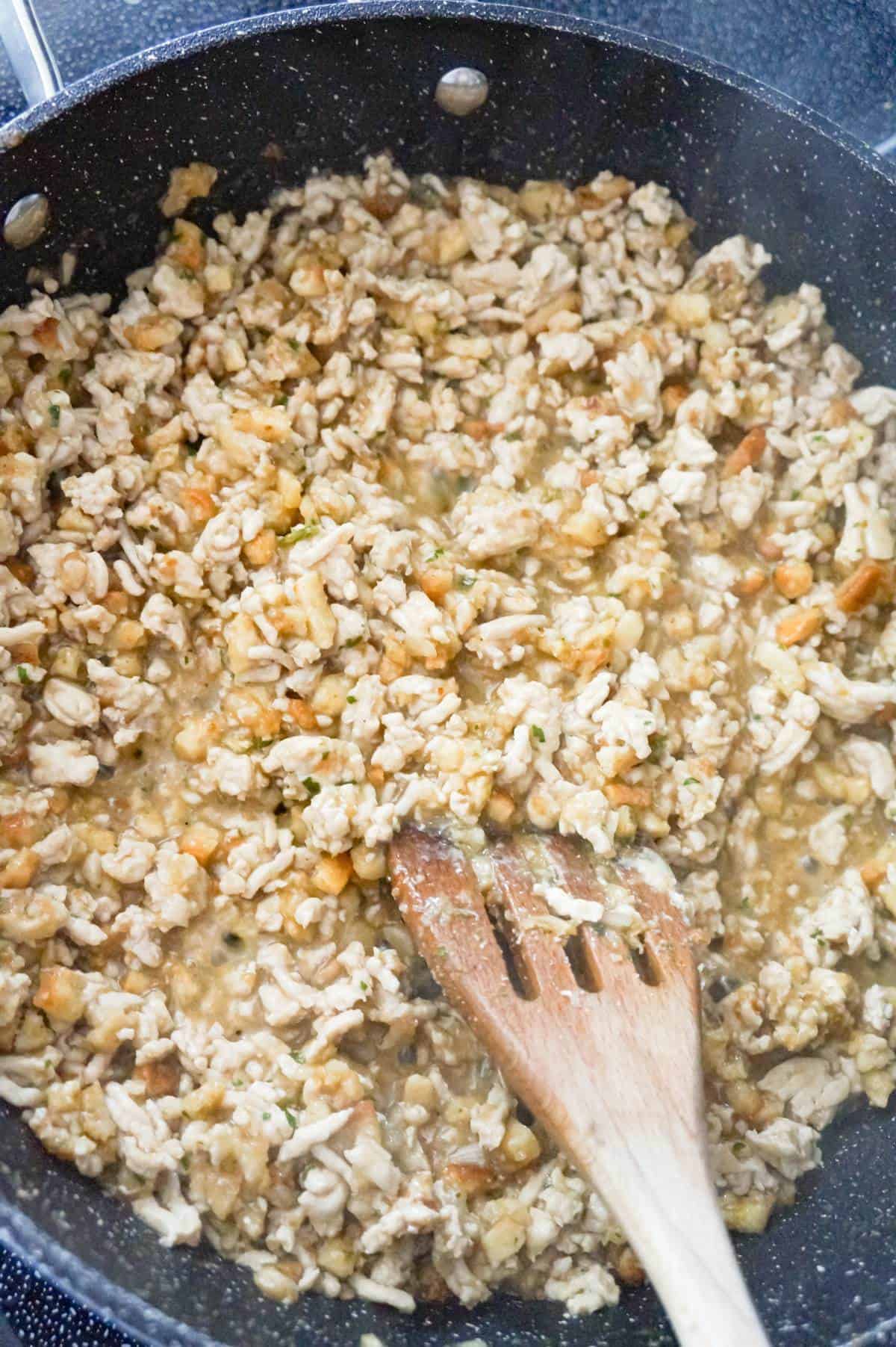 ground turkey, stuffing and gravy mixture in a saute pan