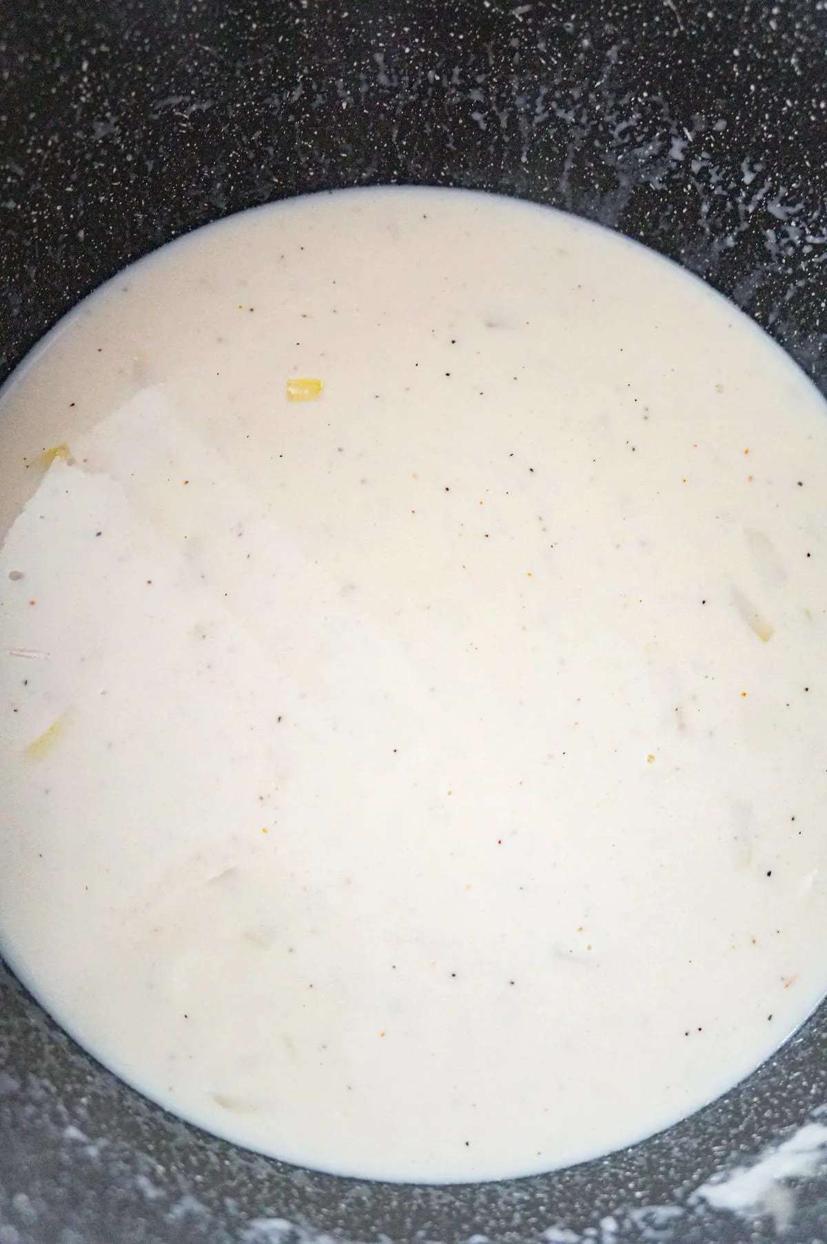 milk and chicken broth mixture in a large pot
