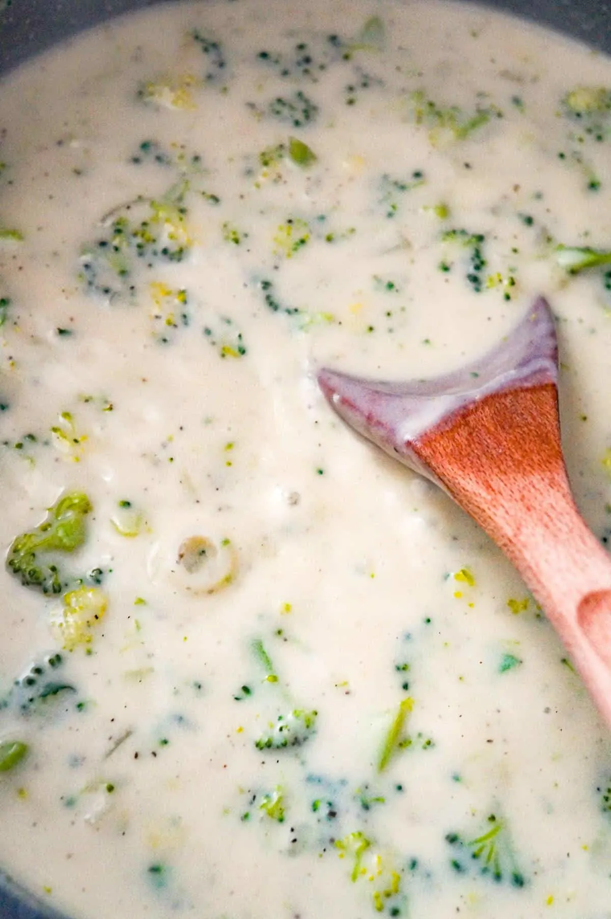 creamy broccoli soup simmering in a pot
