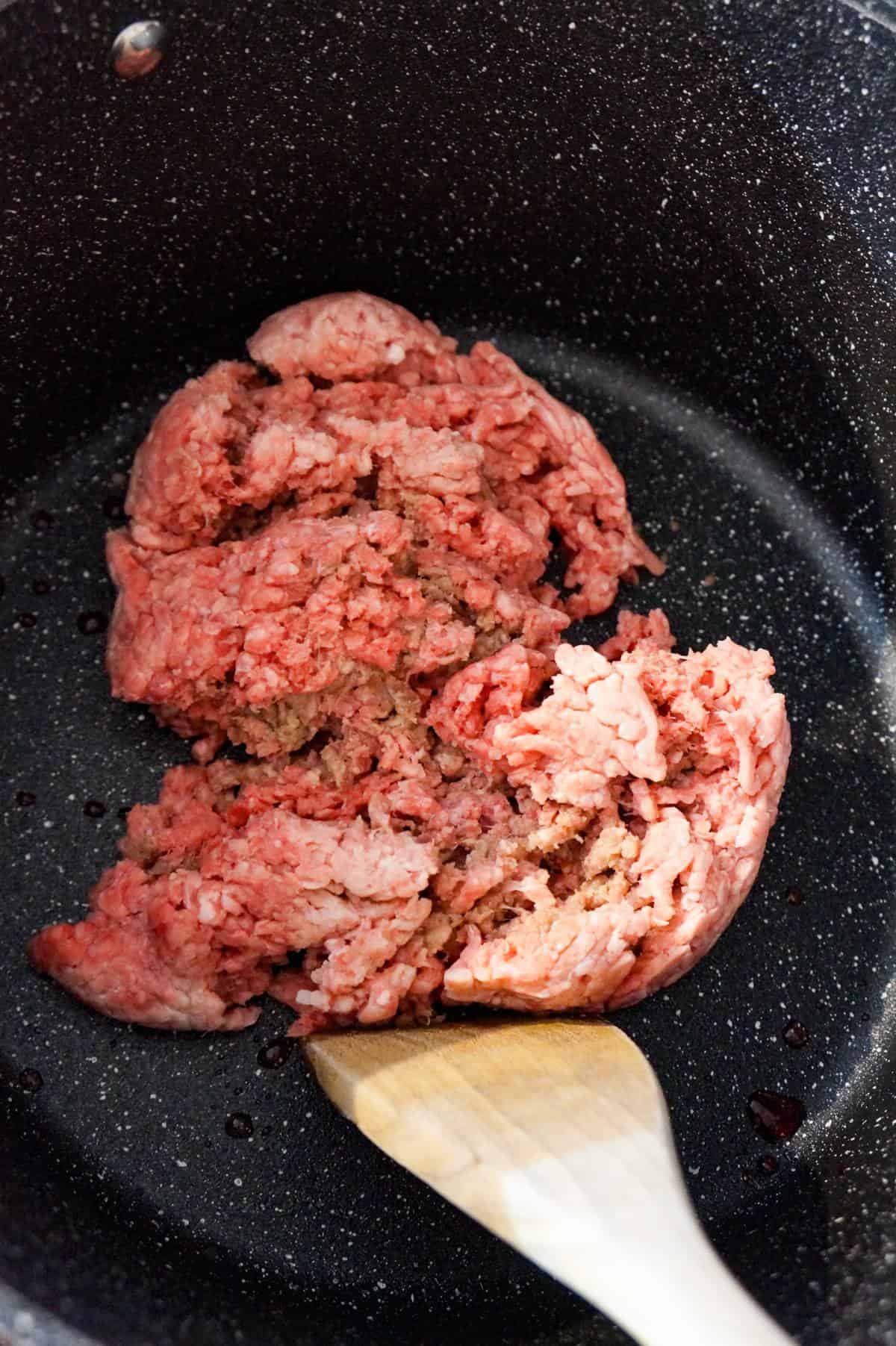 raw ground beef in a large pot