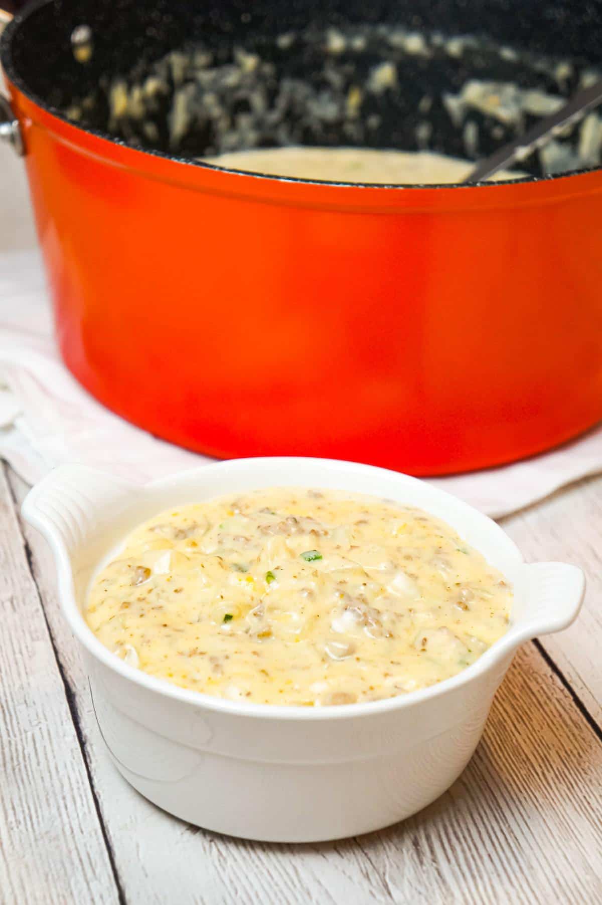 Cheesy Hamburger Potato Soup is a hearty soup recipe loaded with ground beef, diced potatoes, chopped green onions and shredded cheddar cheese.