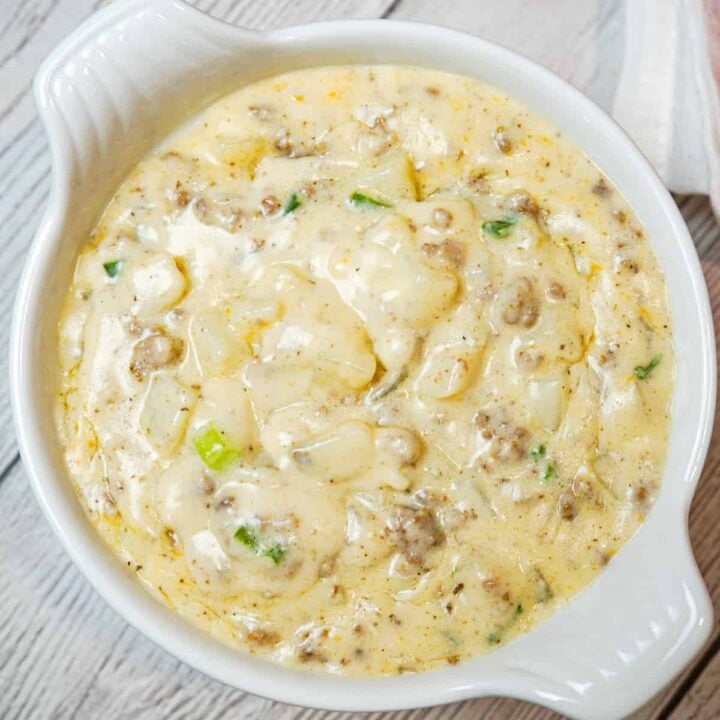 Cheesy Hamburger Potato Soup is a hearty soup recipe loaded with ground beef, diced potatoes, chopped green onions and shredded cheddar cheese.