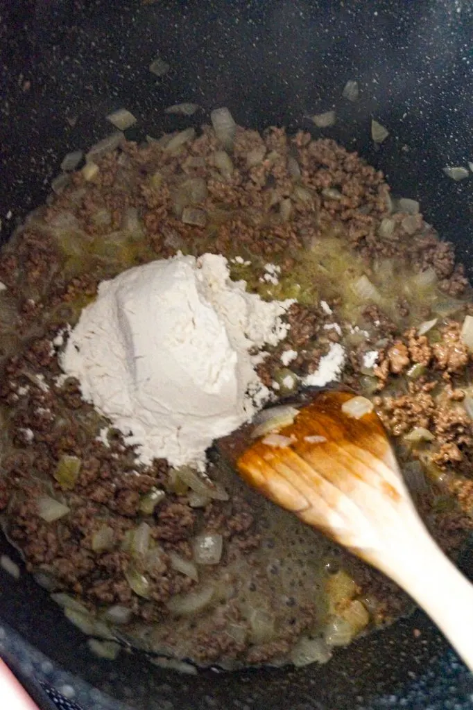 flour on top of butter and cooked ground beef in a large pot