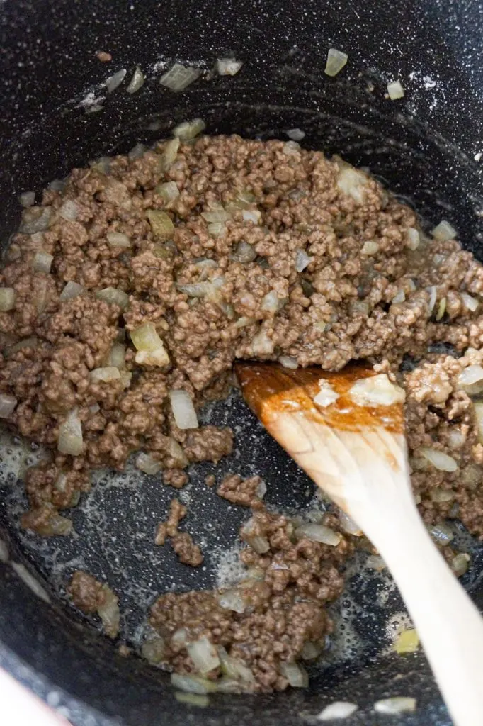 cooked ground beef and flour mixture in a large pot