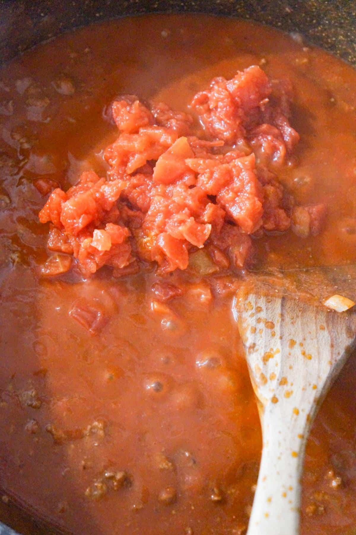 Rotel on top of tomato sauce in a saute pan