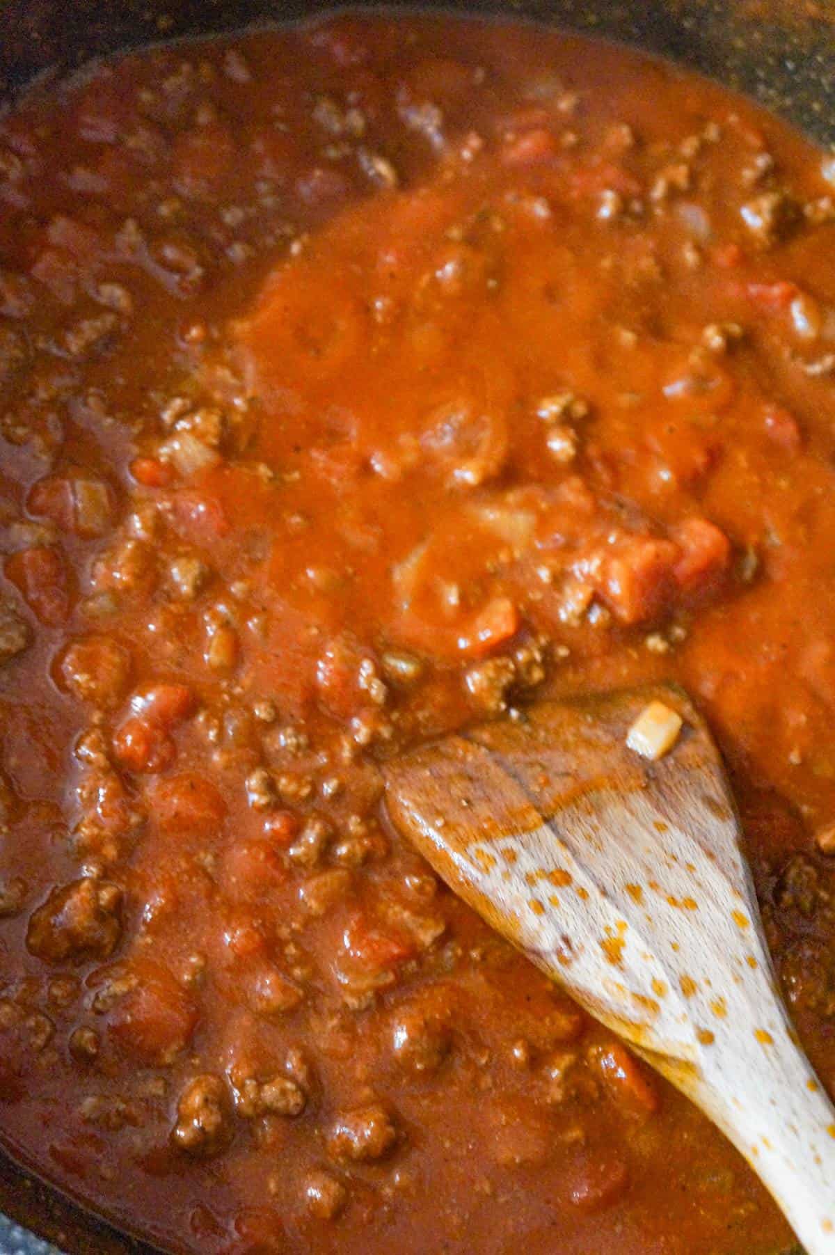 tomato sauce with ground beef in a saute pan
