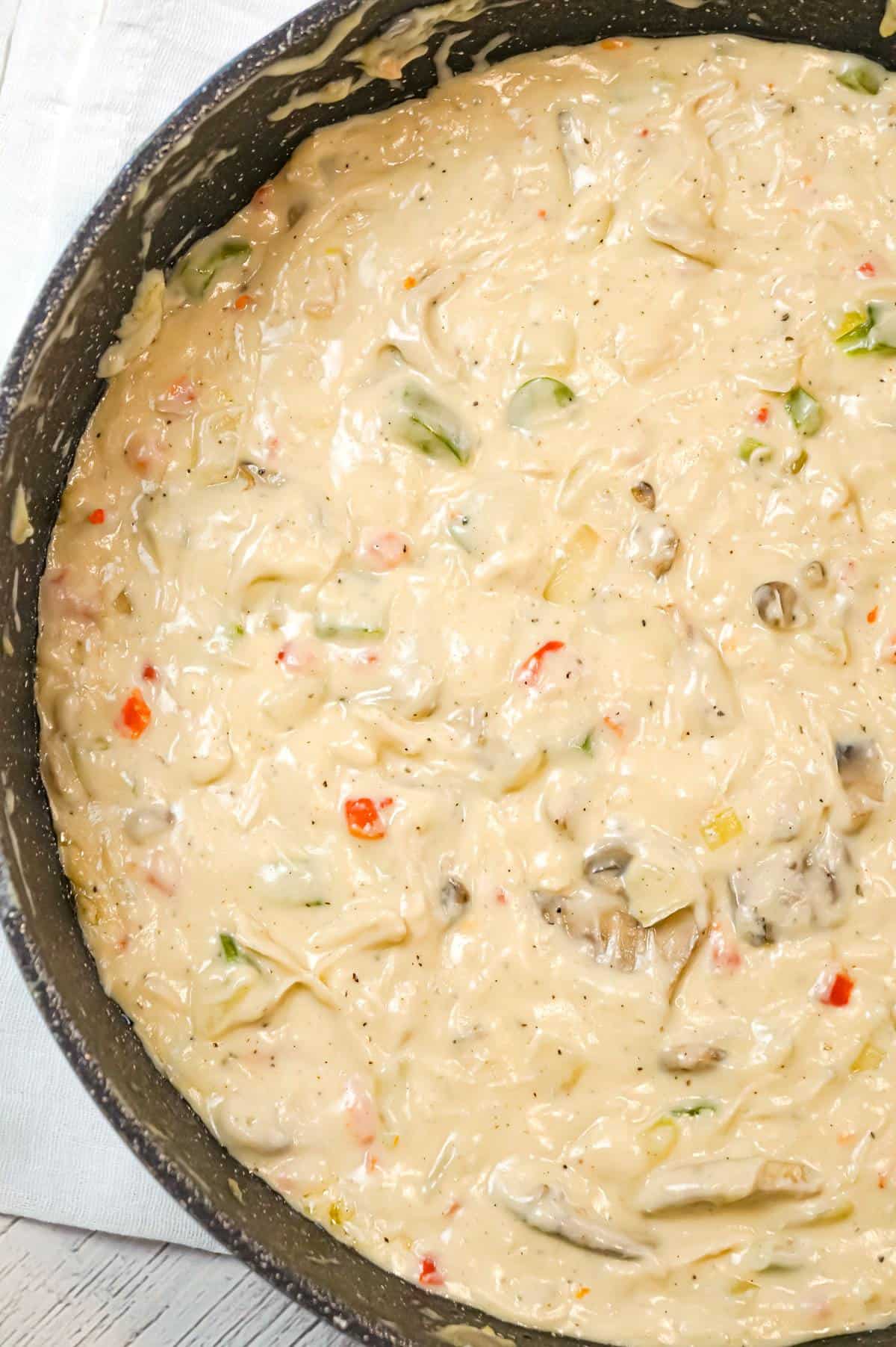 Chicken a la King is an easy stove top chicken dinner recipe made with shredded chicken in a thick and creamy sauce loaded with onions, mushrooms, green peppers and pimentos, served over biscuits, rice or pasta.