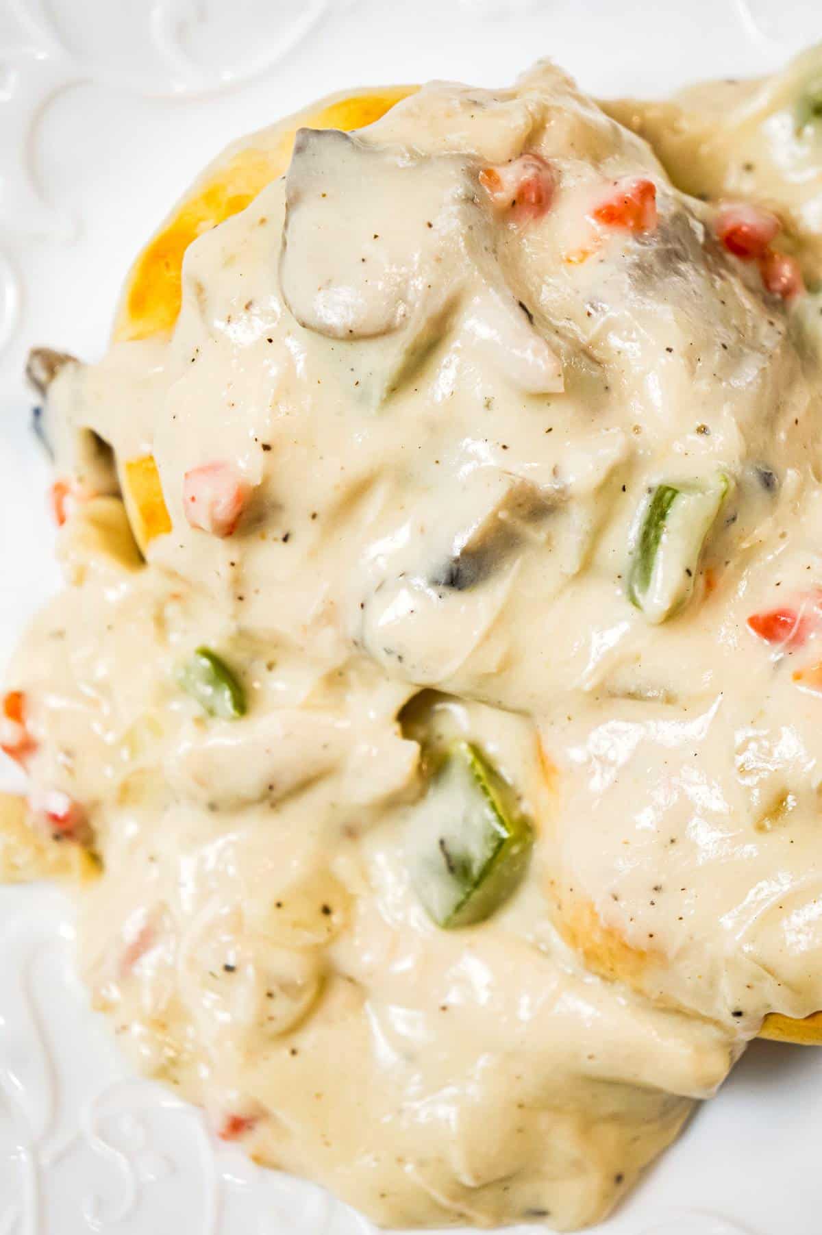 Chicken a la King is an easy stove top chicken dinner recipe made with shredded chicken in a thick and creamy sauce loaded with onions, mushrooms, green peppers and pimentos, served over biscuits, rice or pasta.