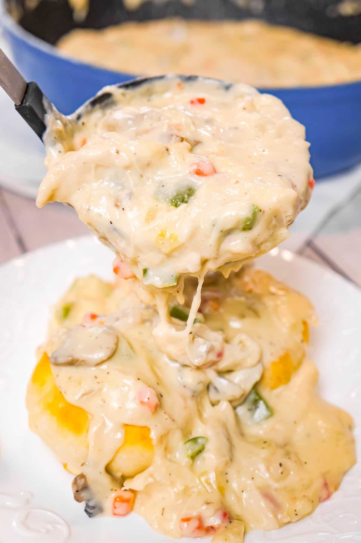 Chicken a la King is an easy stove top chicken dinner recipe made with shredded chicken in a thick and creamy sauce loaded with onions, mushrooms, green peppers and pimentos, served over biscuits, rice or pasta.