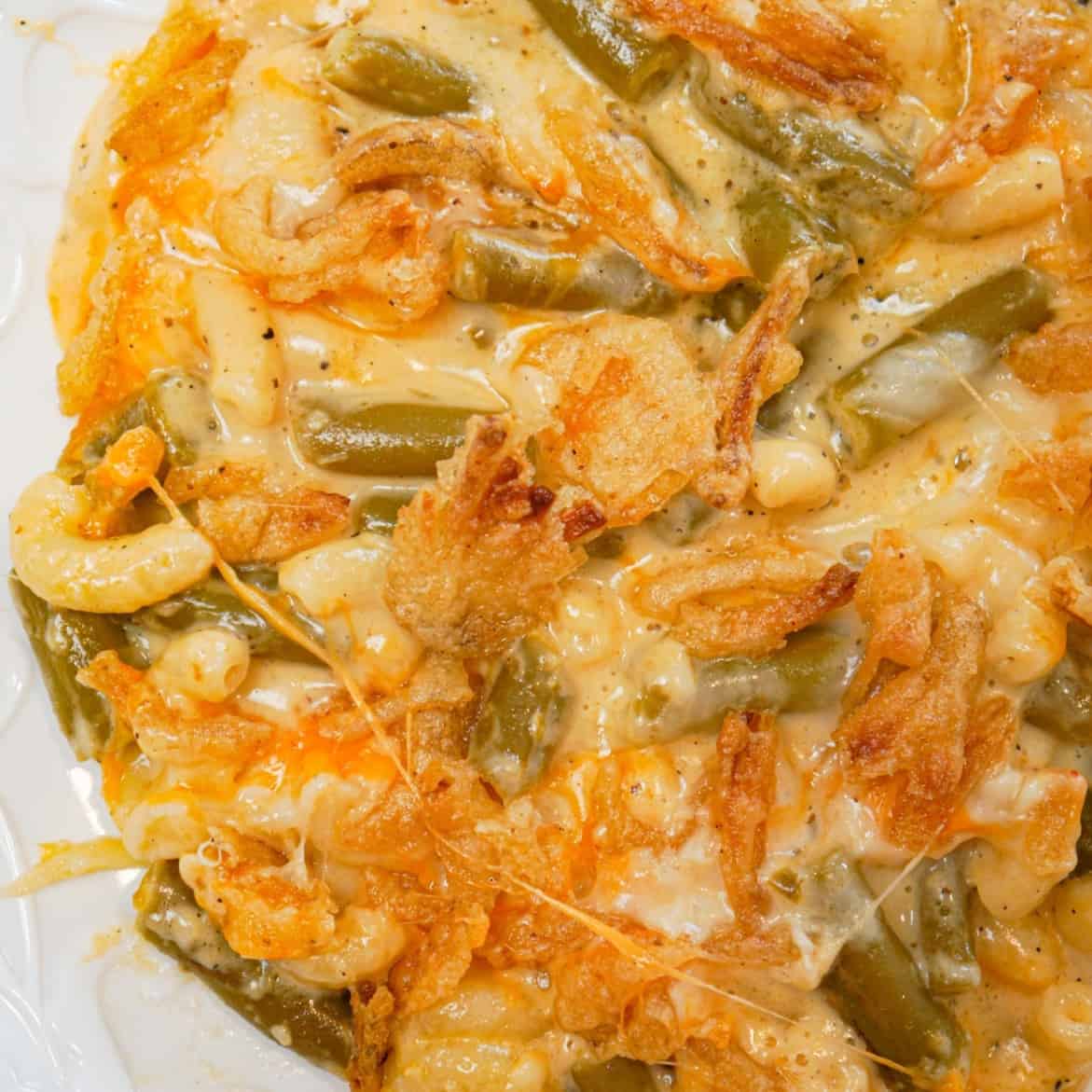 Mac and Cheese Green Bean Casserole is a tasty side dish recipe loaded with macaroni and green beans in a creamy cheese sauce, all topped with French's crispy fried onions!