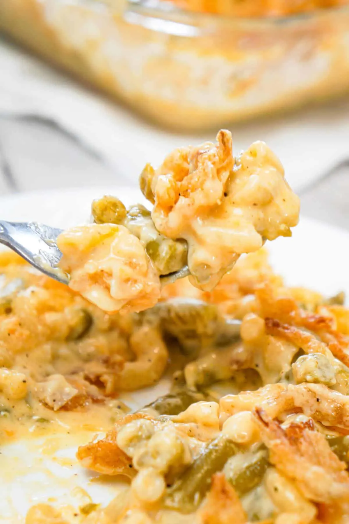 Mac and Cheese Green Bean Casserole is a tasty side dish recipe loaded with macaroni and green beans in a creamy cheese sauce, all topped with French's crispy fried onions!