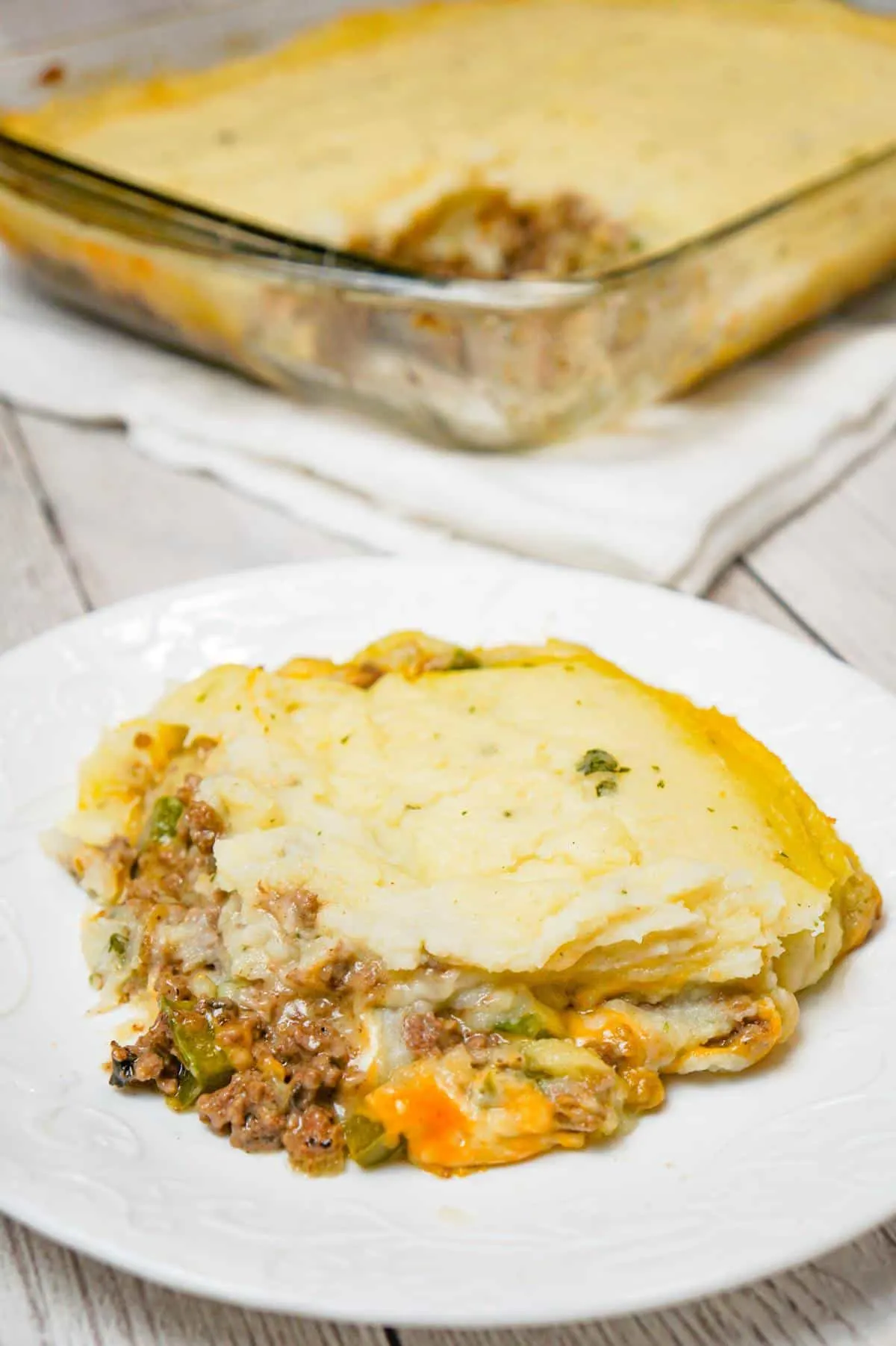 Philly Cheese Steak Shepherd's Pie is an easy casserole recipe loaded with ground beef, onions, green peppers, cheese and mashed potatoes.