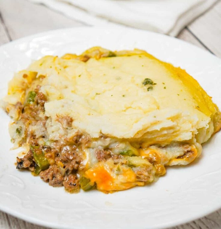 Philly Cheese Steak Shepherd's Pie is an easy casserole recipe loaded with ground beef, onions, green peppers, cheese and mashed potatoes.