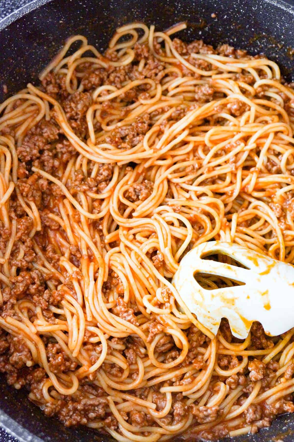 spaghetti with ground beef in a saute pan