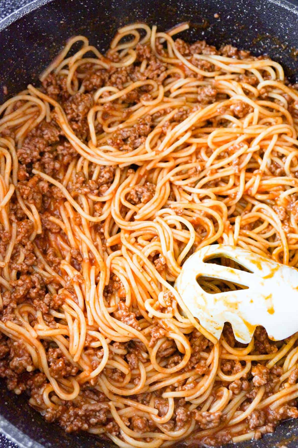 spaghetti with ground beef in a saute pan
