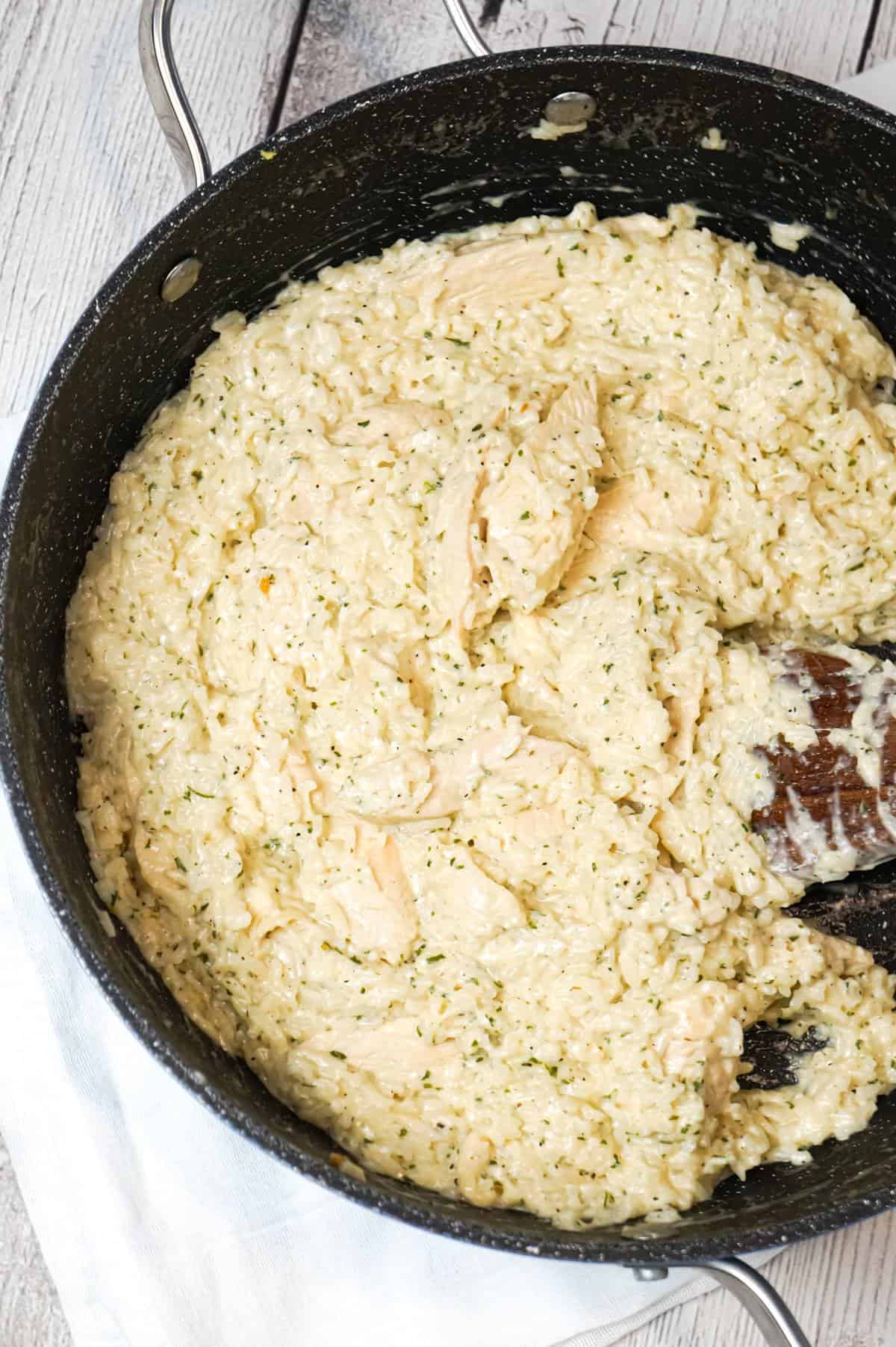 One Pot Garlic Parmesan Chicken and Rice is an easy weeknight dinner recipe made with boneless, skinless chicken breasts, Minute rice, garlic puree, cream and Parmesan cheese.