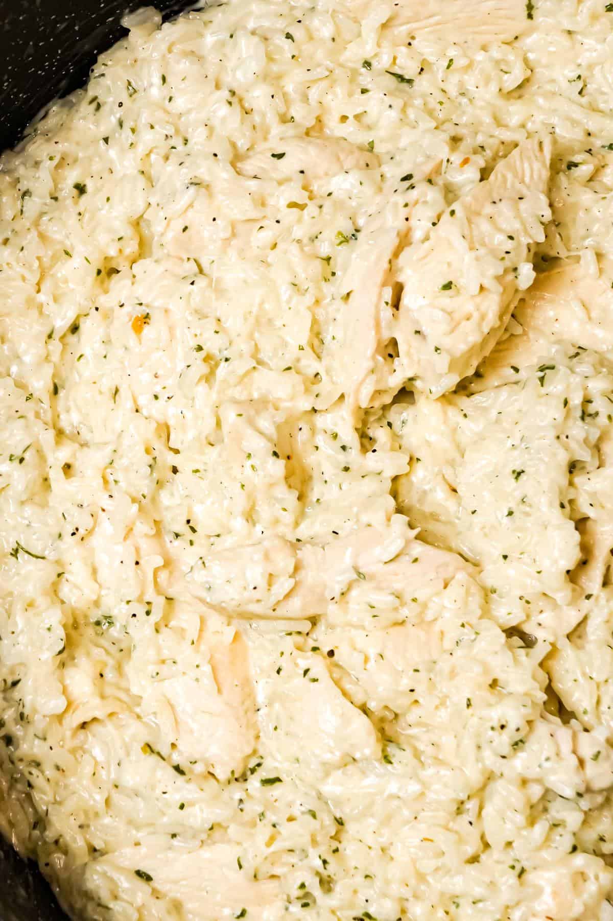 One Pot Garlic Parmesan Chicken and Rice is an easy weeknight dinner recipe made with boneless, skinless chicken breasts, Minute rice, garlic puree, cream and Parmesan cheese.