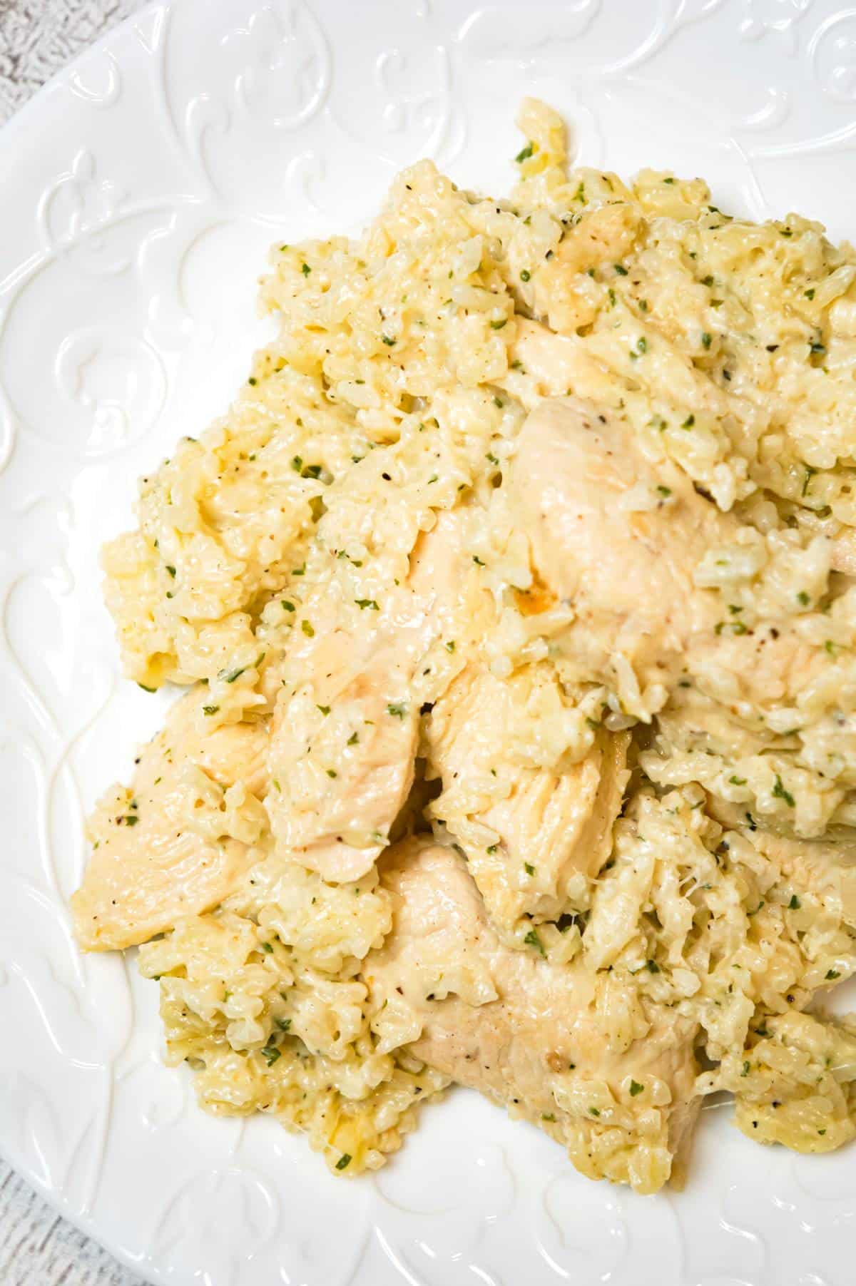 One Pot Garlic Parmesan Chicken and Rice is an easy weeknight dinner recipe made with boneless, skinless chicken breasts, Minute rice, garlic puree, cream and Parmesan cheese.