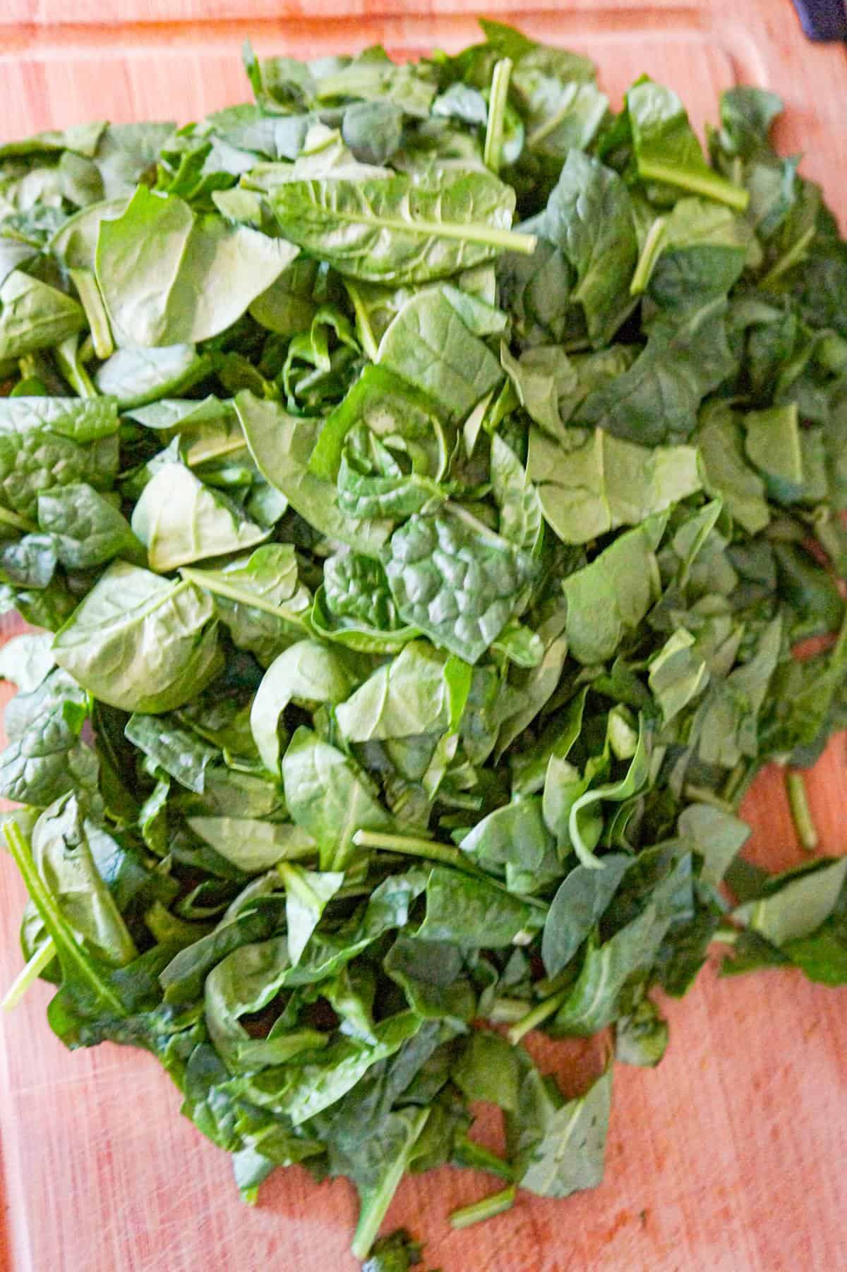 chopped spinach on a cutting board