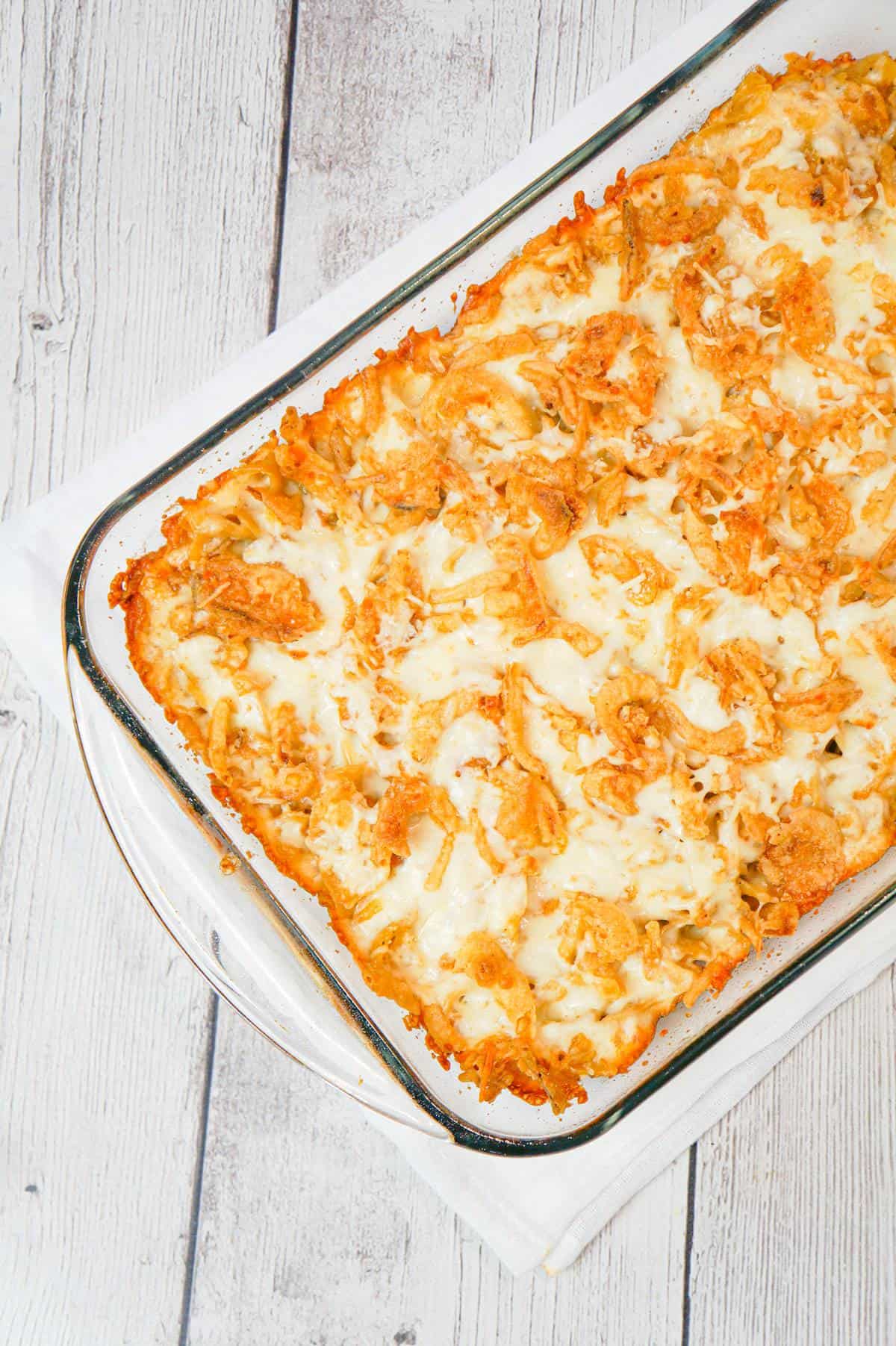 French Onion Chicken Casserole is a hearty casserole recipe loaded with shredded chicken, egg noodles, onion soup mix, cream of chicken soup, mozzarella cheese, parmesan cheese and French's crispy fried onions.