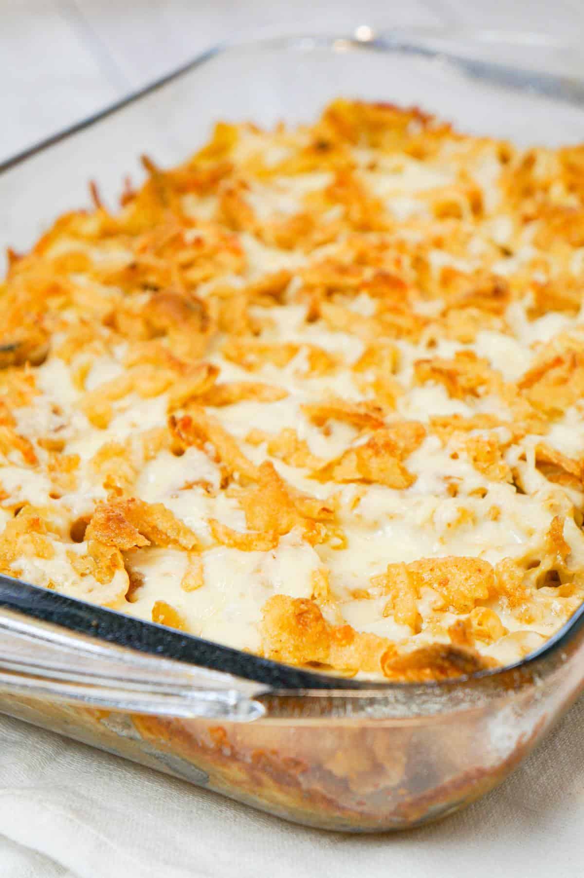 French Onion Chicken Casserole is a hearty casserole recipe loaded with shredded chicken, egg noodles, onion soup mix, cream of chicken soup, mozzarella cheese, parmesan cheese and French's crispy fried onions.